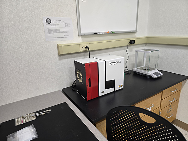 20250507_141915_Web A piece of equipment is sitting on a counter in the corner of a lab.