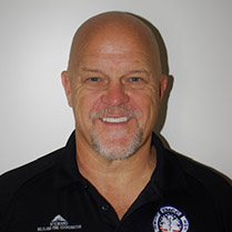 Headshot of William smiling and against a white background.