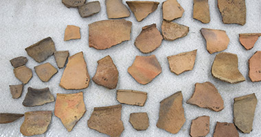 pieces of ceramic laid out on a foam layer for protection.