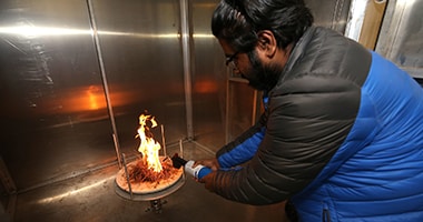 man burning material