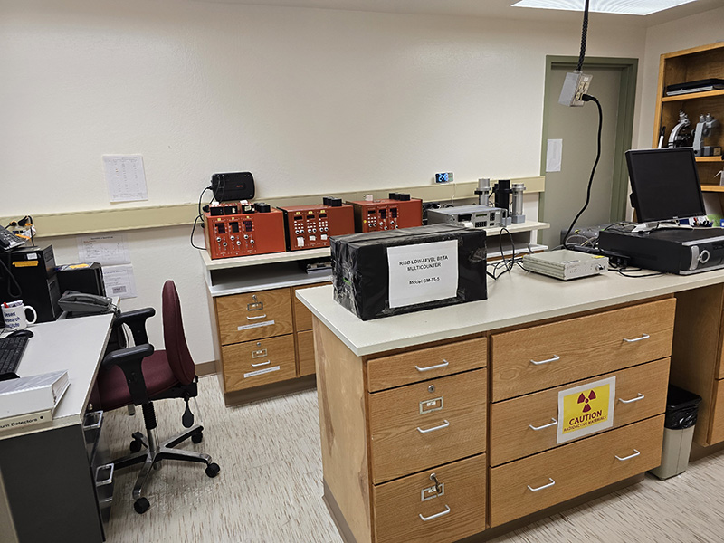 DRILL_Lab_web Image of a lab with an island and equipment on the counters.