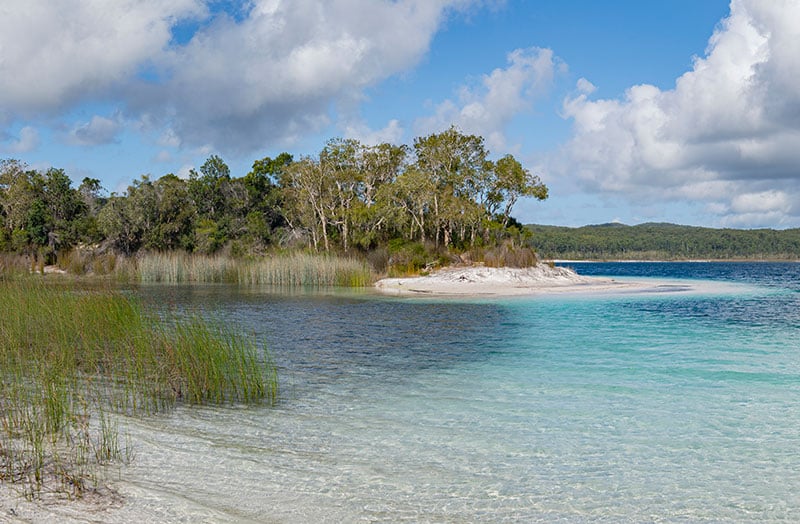 distant island surrounded by clear water