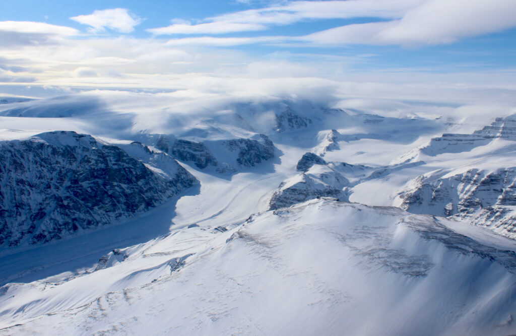 Ice capped and snow-covered mountains of coastal west Greenland. (Apr. 2015)