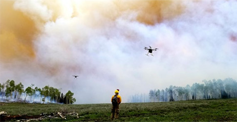 Screenshot Researcher flying a drone into an active wildfire.