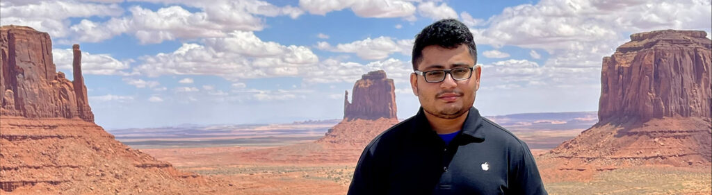 Photo of Monty standing in front of Monument Valley in Arizona