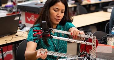 woman building a robot