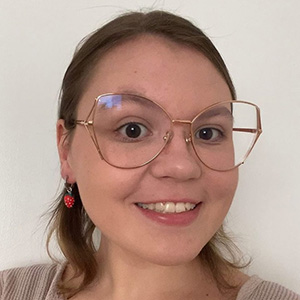 Ruby Headshot 300px Headshot of Ruby wearing glasses and smiling.