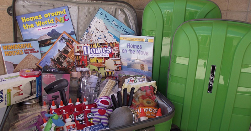 Green box open and showing all the supplies included.