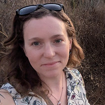 Stacey Frederick AWE2025 Headshot of Stacey taken outside at sunset.
