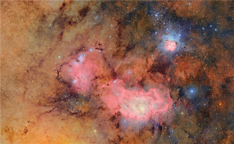 Image of space with colorful galaxies and stars.