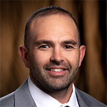 Vega Francisco 209px Headshot of Francisco Vega wearing a grey suit against a neutral background.