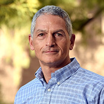 Vic-Etyemezian-Leadership 209px Headshot of Dr. Vic Etyemezian outside with trees in the background.