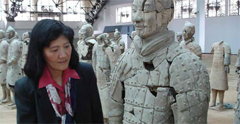 Screenshot Researcher looking at a terracotta soldier being preserved.